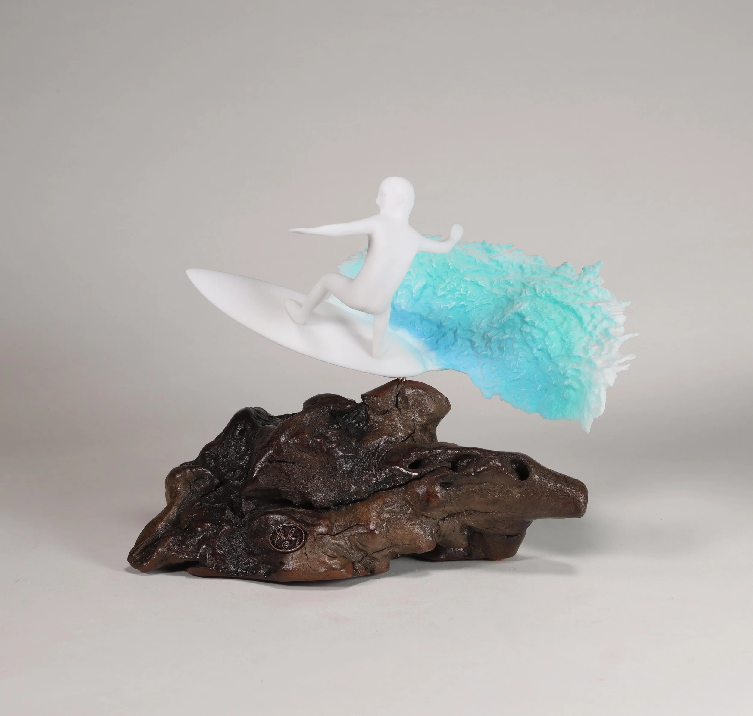 Surfer Sculpture With Blue Wave 9in Long on Burlwood — JOHN PERRY